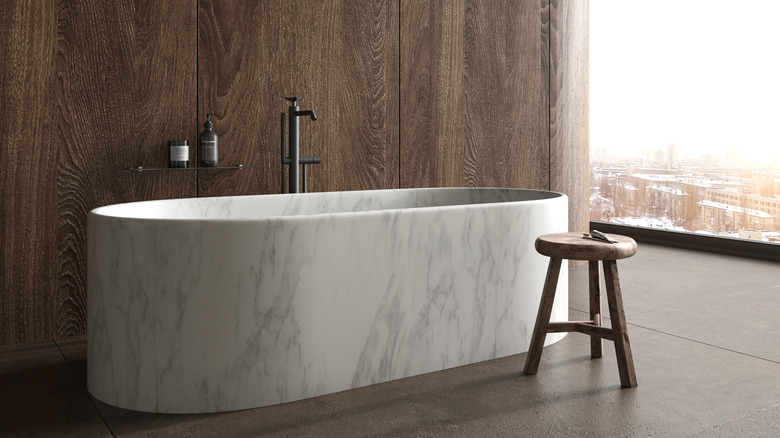 marble bathtub with a stool