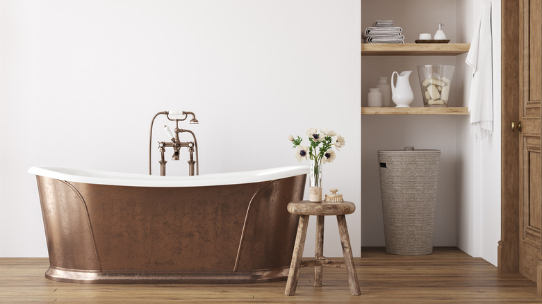 room with a copper bathtub