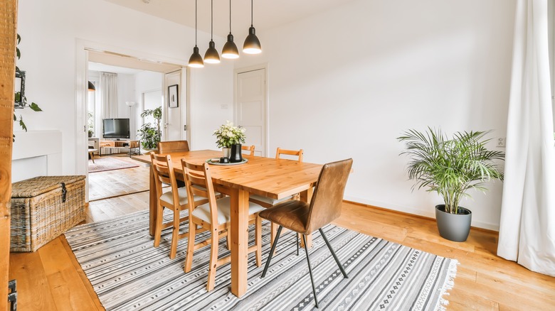 striped rug under wooden table