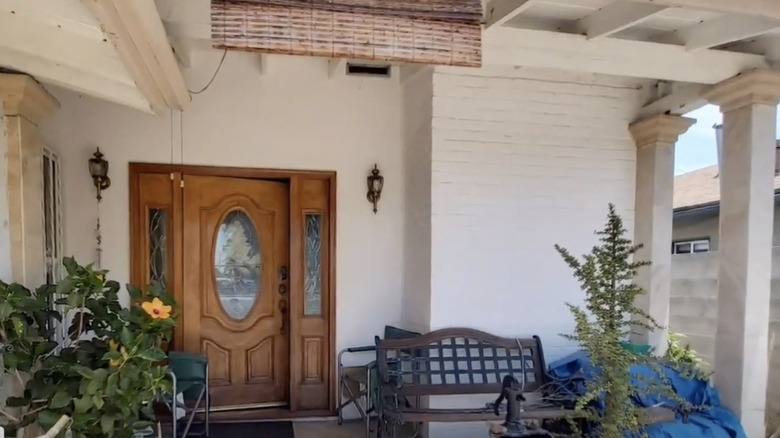 Messy porch with gardening equipment