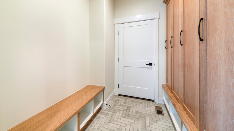 wooden entryway bench with cabinets