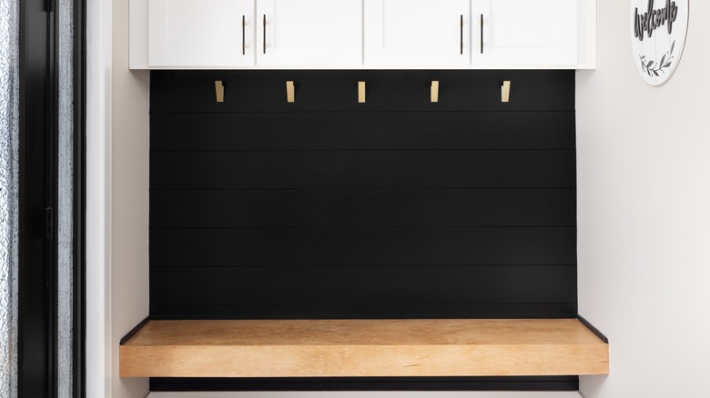 black backdrop with wooden bench