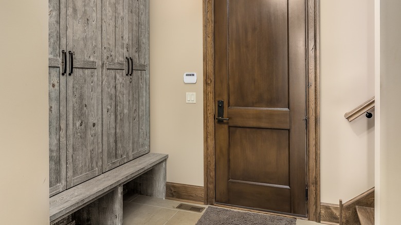 gray wood bench and cabinets