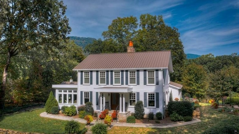 White colonial house, blue trim