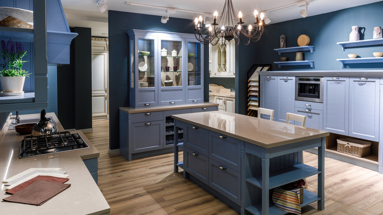 red walls, cabinets, and shelves