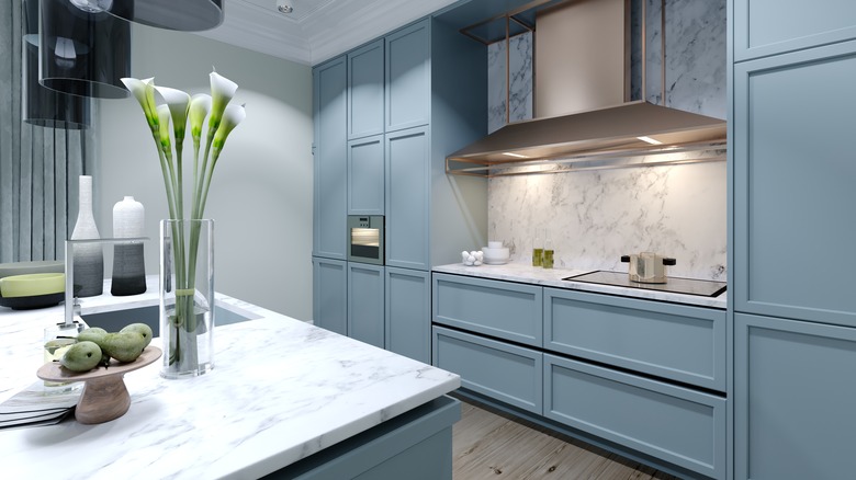 light blue cabinets with marble