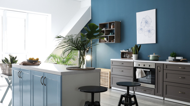 blue wall with gray cabinets