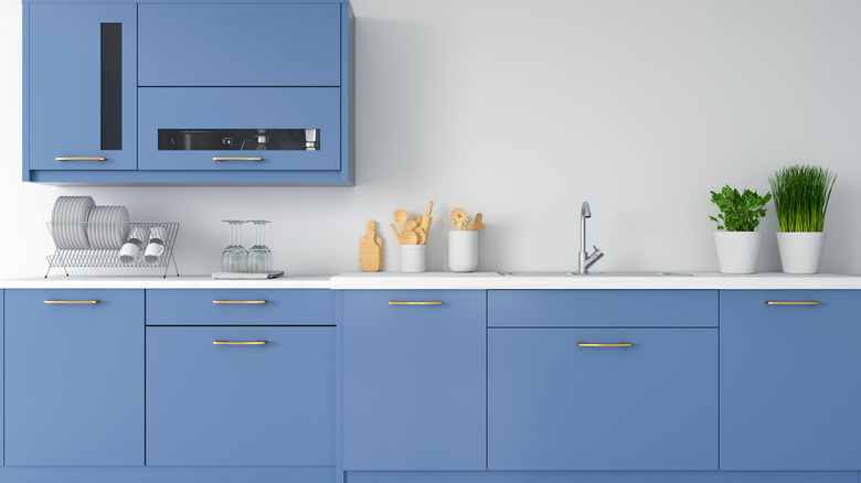 pastel blue and gold cabinets