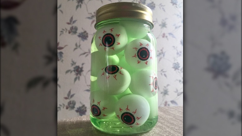 eyeballs in green jar