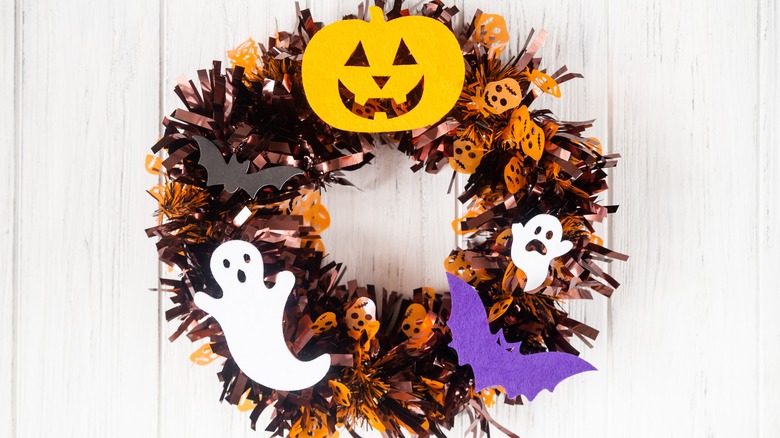 wreath with pumpkin and ghost cutouts