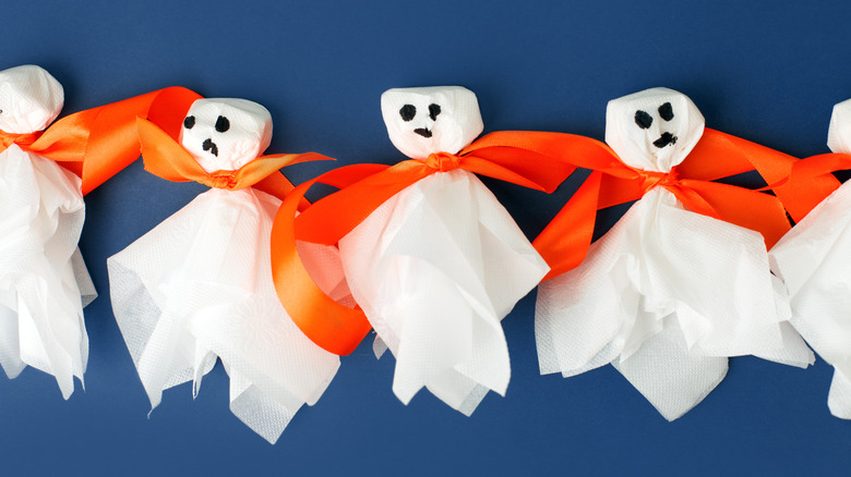 napkin ghosts with orange ribbon