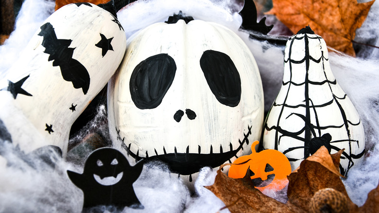 skeleton painted pumpkin and gourds