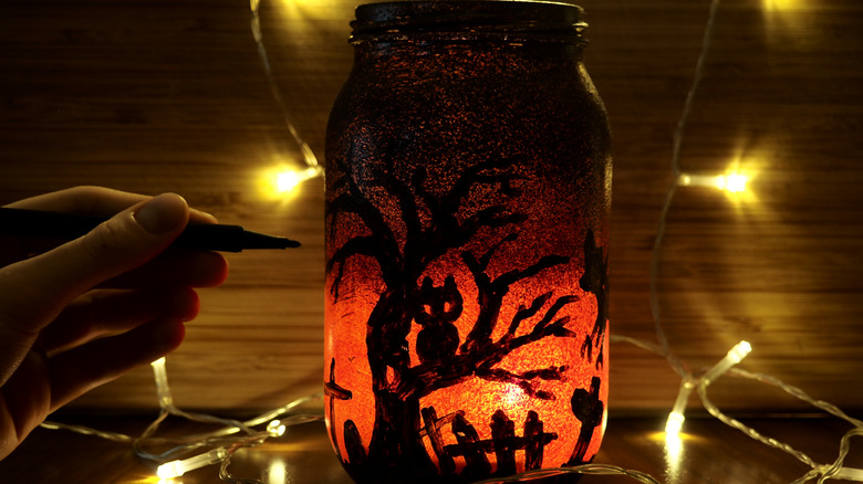 black and red decorated jar