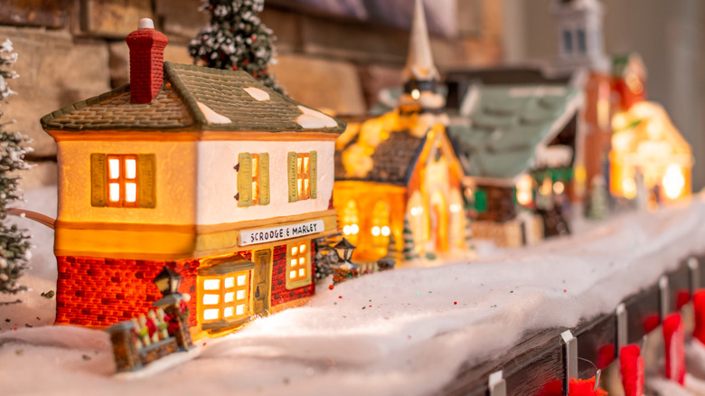Christmas village displayed on mantel