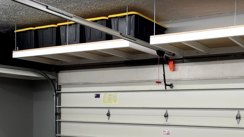 garage shelves with black bins