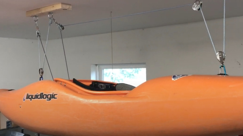 kayak hanging from ceiling