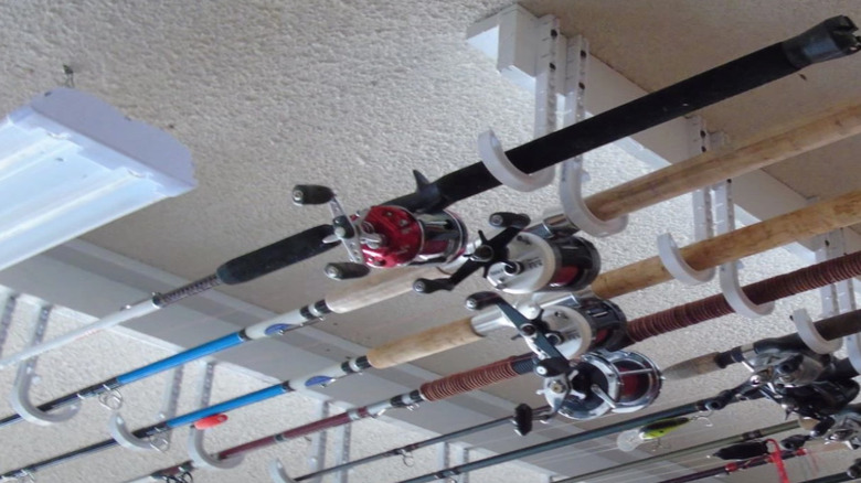 fishing poles on white hooks