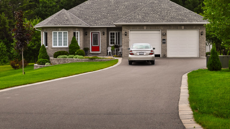 concrete driveway with brick border