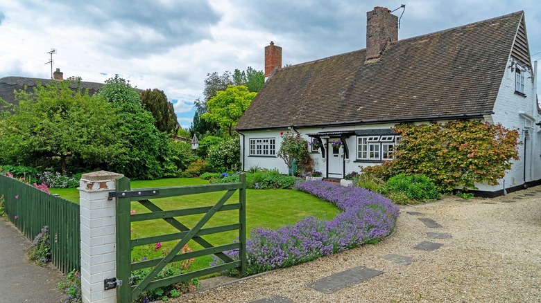 gravel driveway with rural home