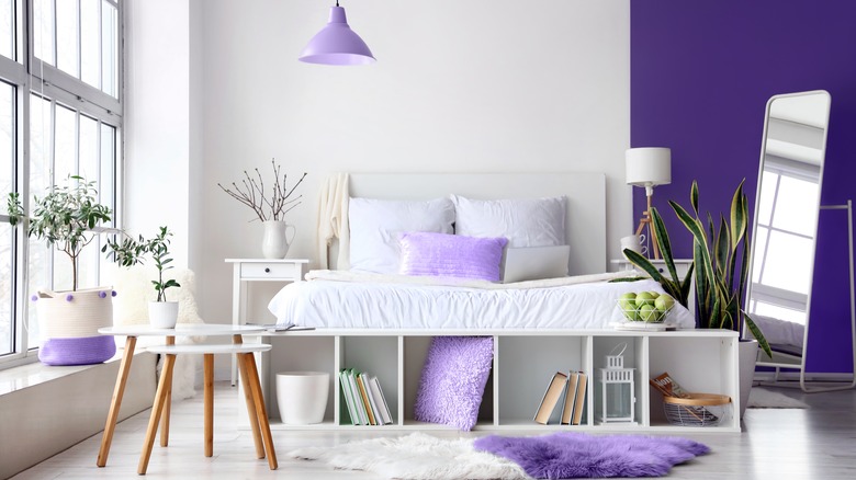 white bedroom with purple wall