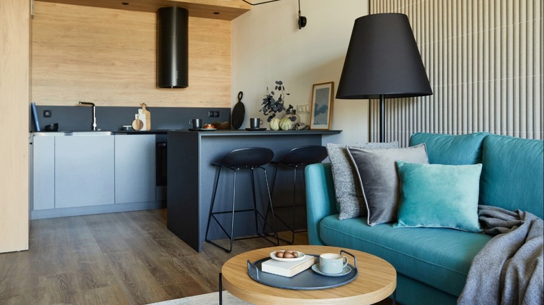 Modern apartment with teal sofa