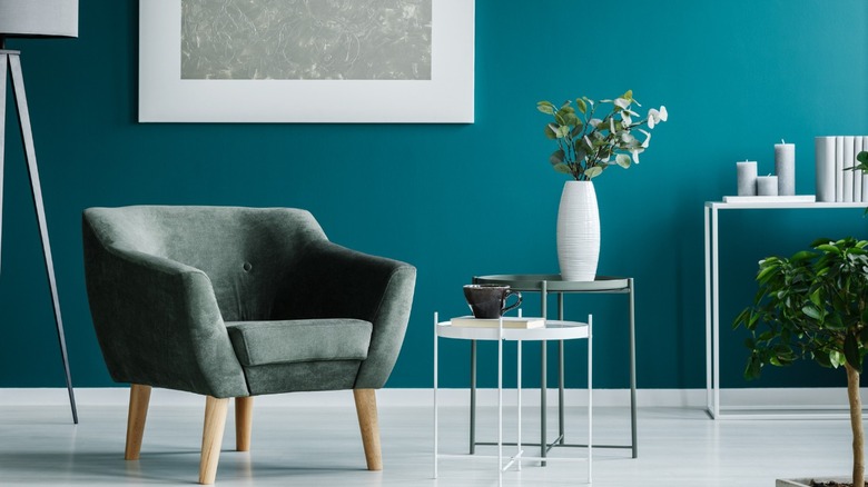 Teal room with green chair