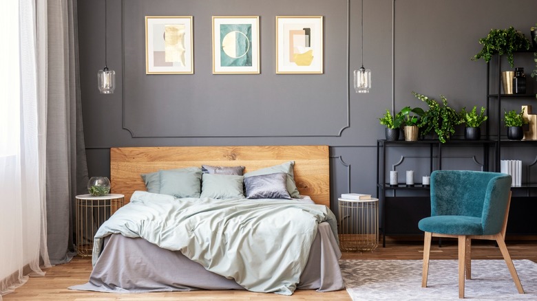 Gray bedroom with teal chair