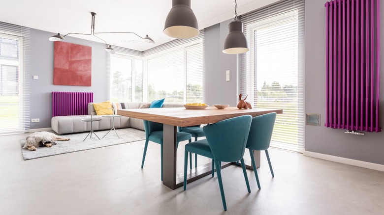 Dining room with teal chairs