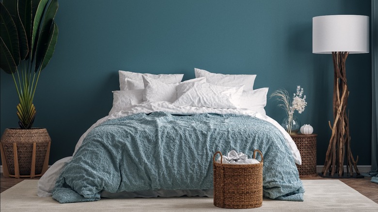 Teal bedroom with white bedding