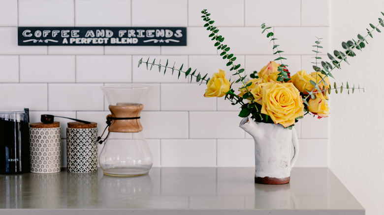 coffee counter with yellow roses