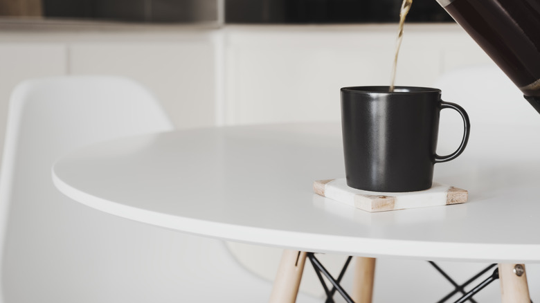 coffee being poured on table