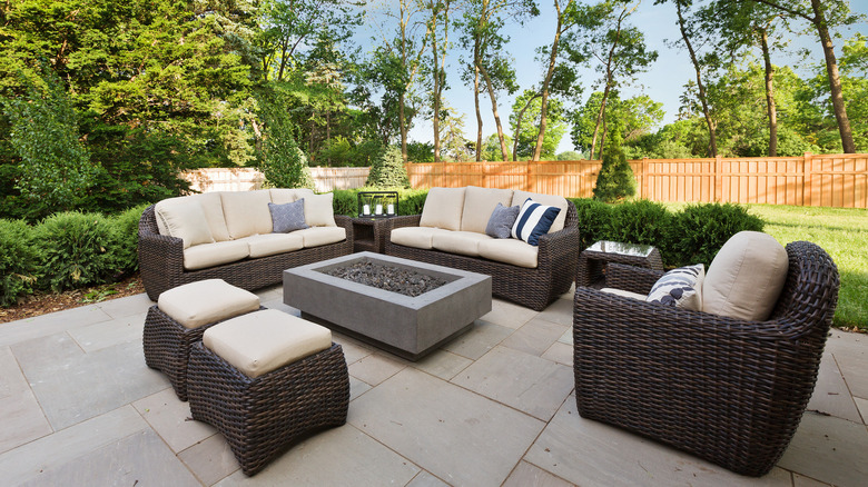 concrete patio with wicker patio furniture