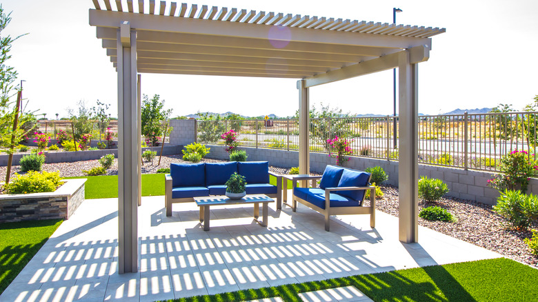 patio with blue furniture and gazebo