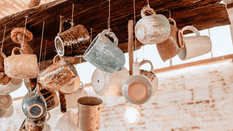 mugs hanging from twine