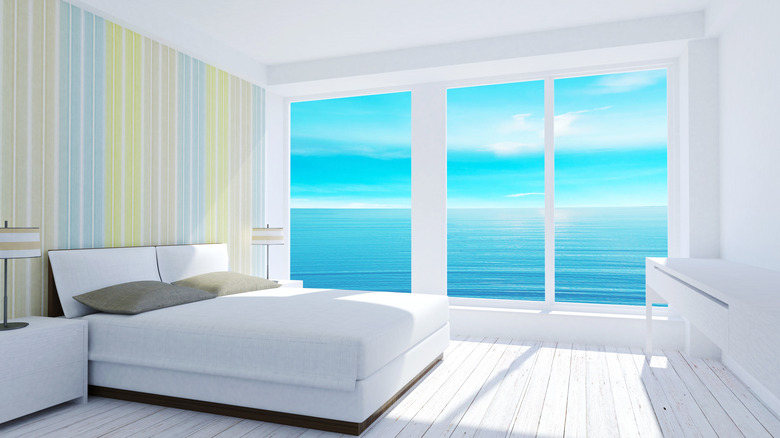 White bedroom with multi-colored accent wall