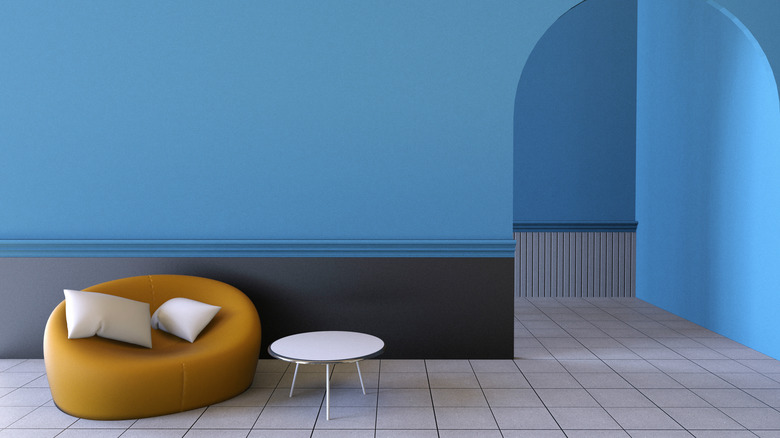 Bright blue walls accented by yellow chair