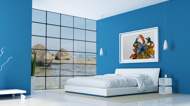 Bright blue walls in a bedroom