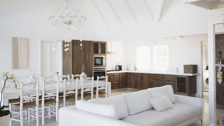 Long white table in kitchen