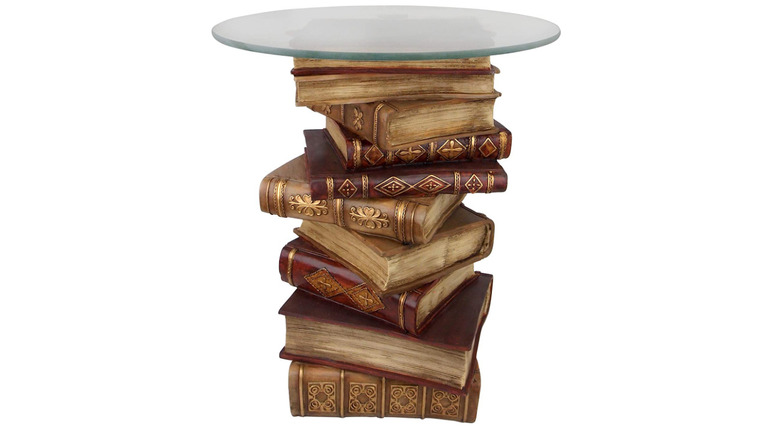 old books stacked with glass top