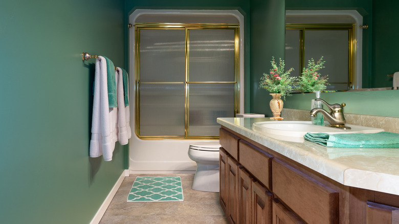 green and gold bathroom 