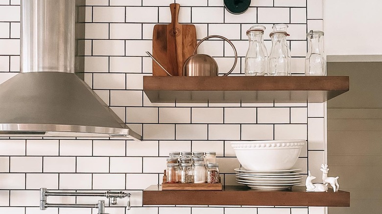 Spice jars on open shelves