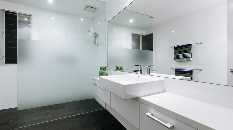 doorless shower with half frosted glass