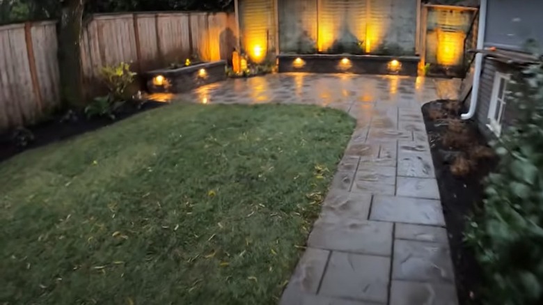 stone patio with outdoor lights