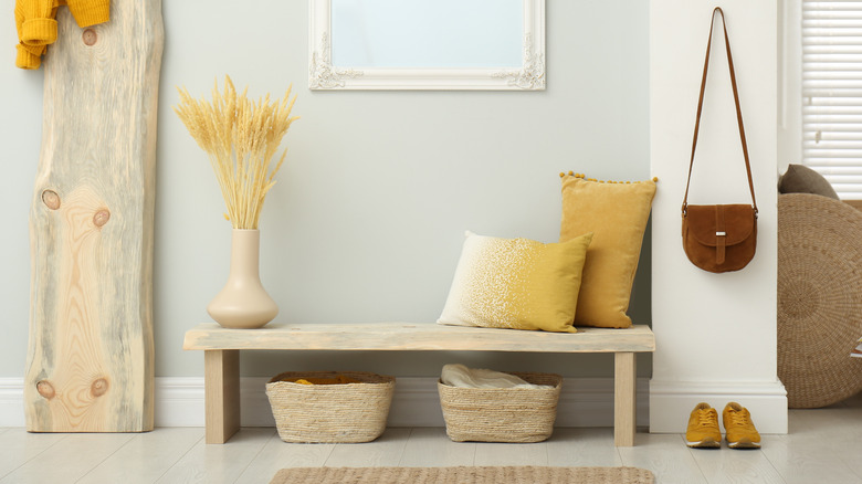 bench with bins in foyer