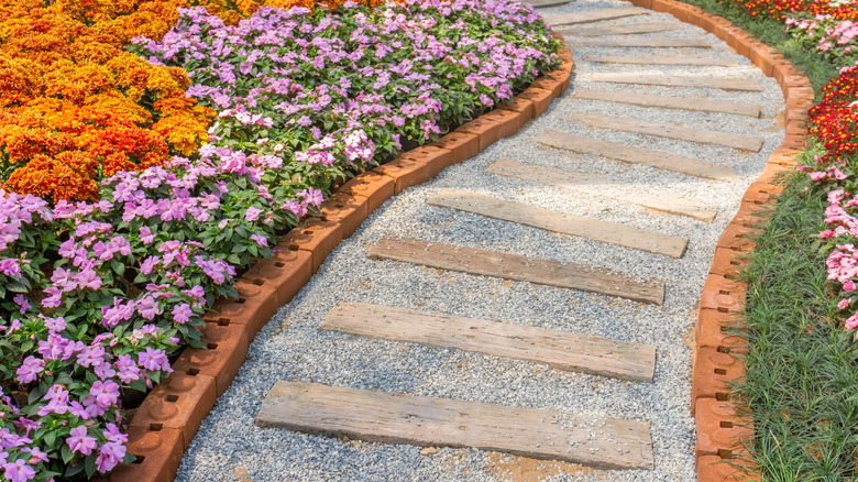 walkway with timber, gravel, and brick