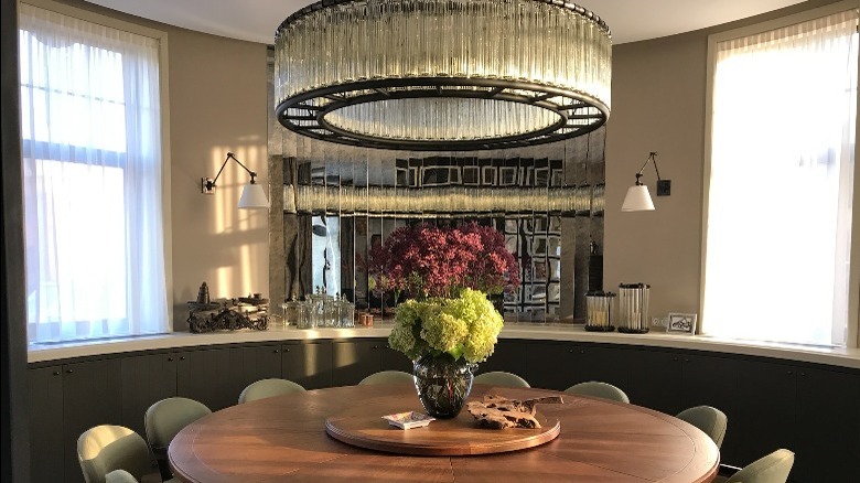 Glam dining room with chandelier