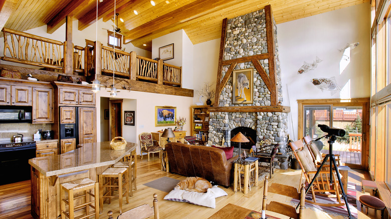 Cabin with tall stone fireplace