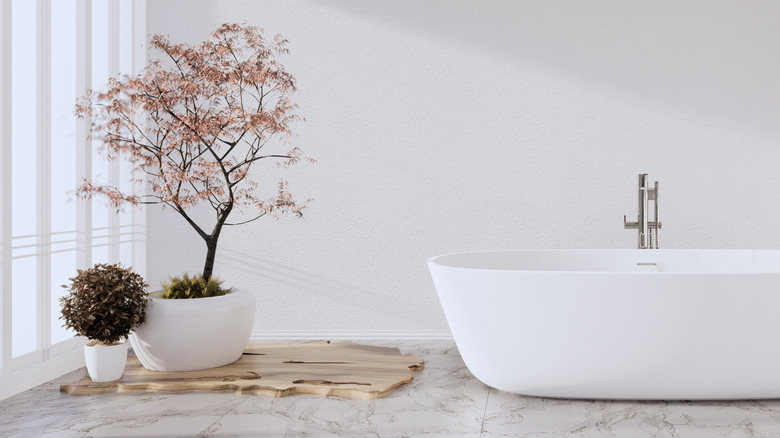 Bathroom with decorative potted tree