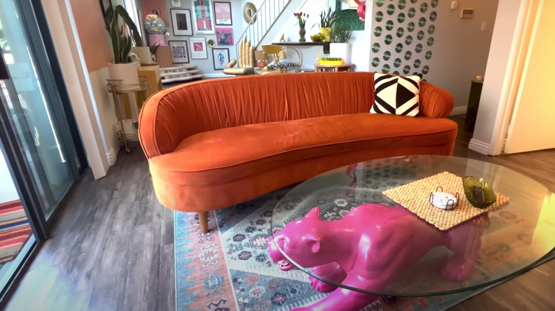 orange couch with panther table