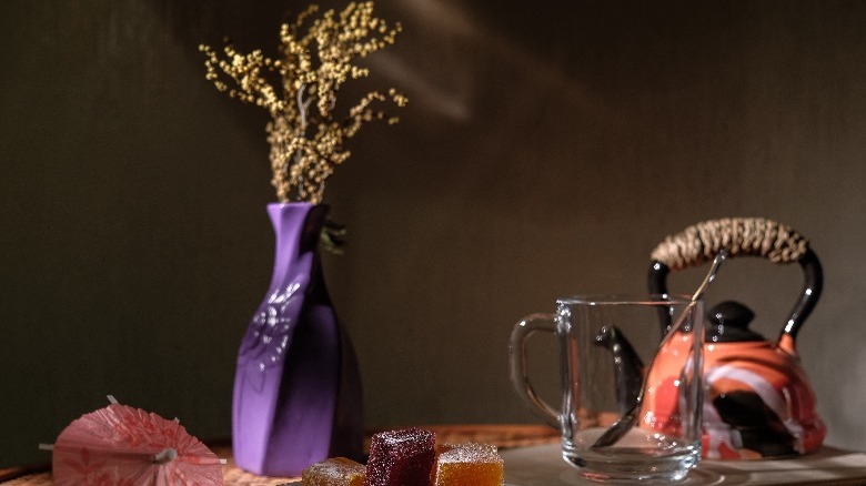 Purple vase in brown room